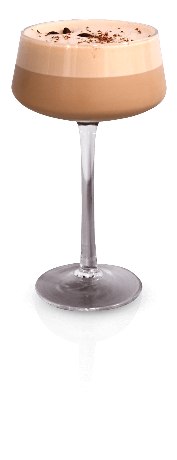 A Hazelnut Mocha Dream Martini in a coupe glass, topped with froth, coffee beans, and chocolate shavings