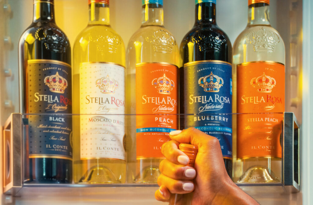 Shelf featuring all the Stella Rosa wine flavors, from sparkling, semi-sweet white wines to semi-sweet red wines