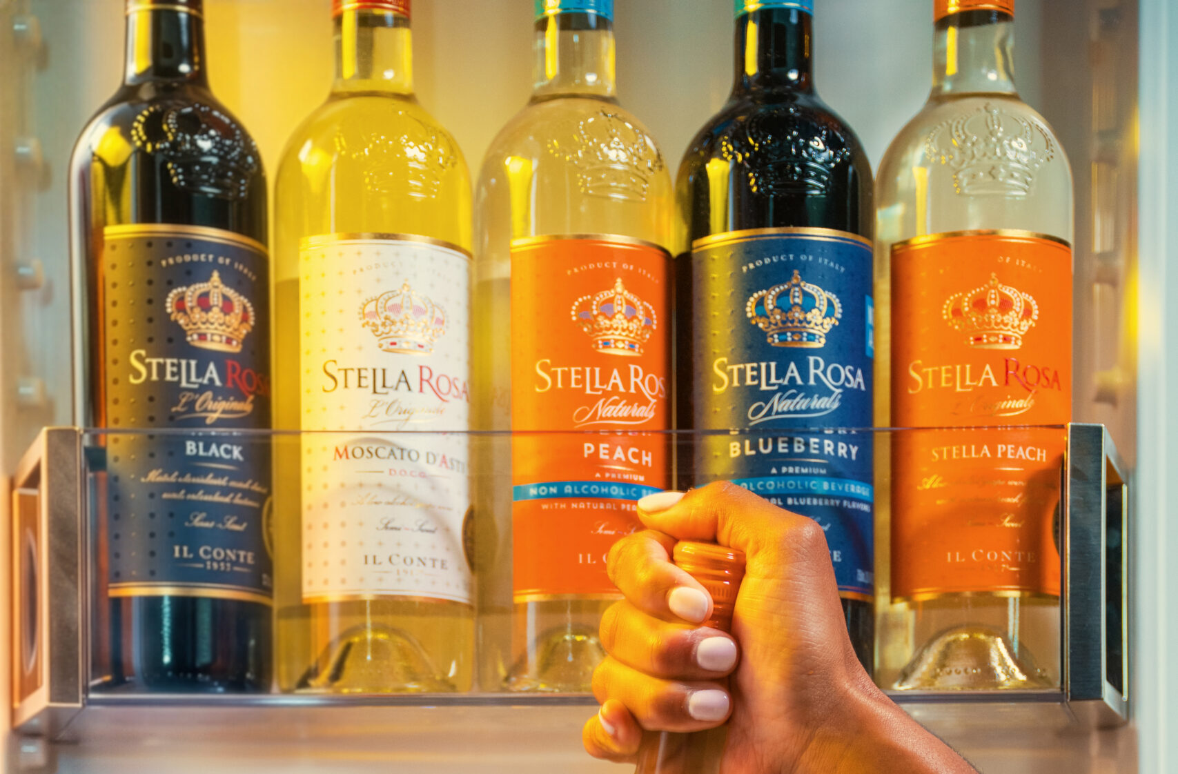 Shelf featuring all the Stella Rosa wine flavors, from sparkling, semi-sweet white wines to semi-sweet red wines