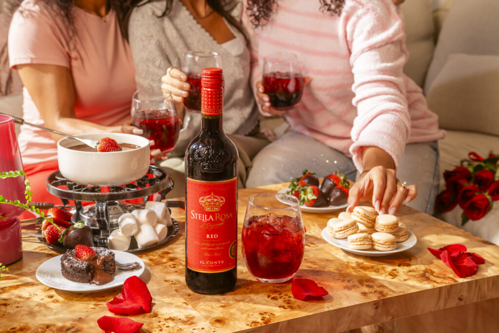 Friends enjoy a bottle of Stella Rosa Italian red wine