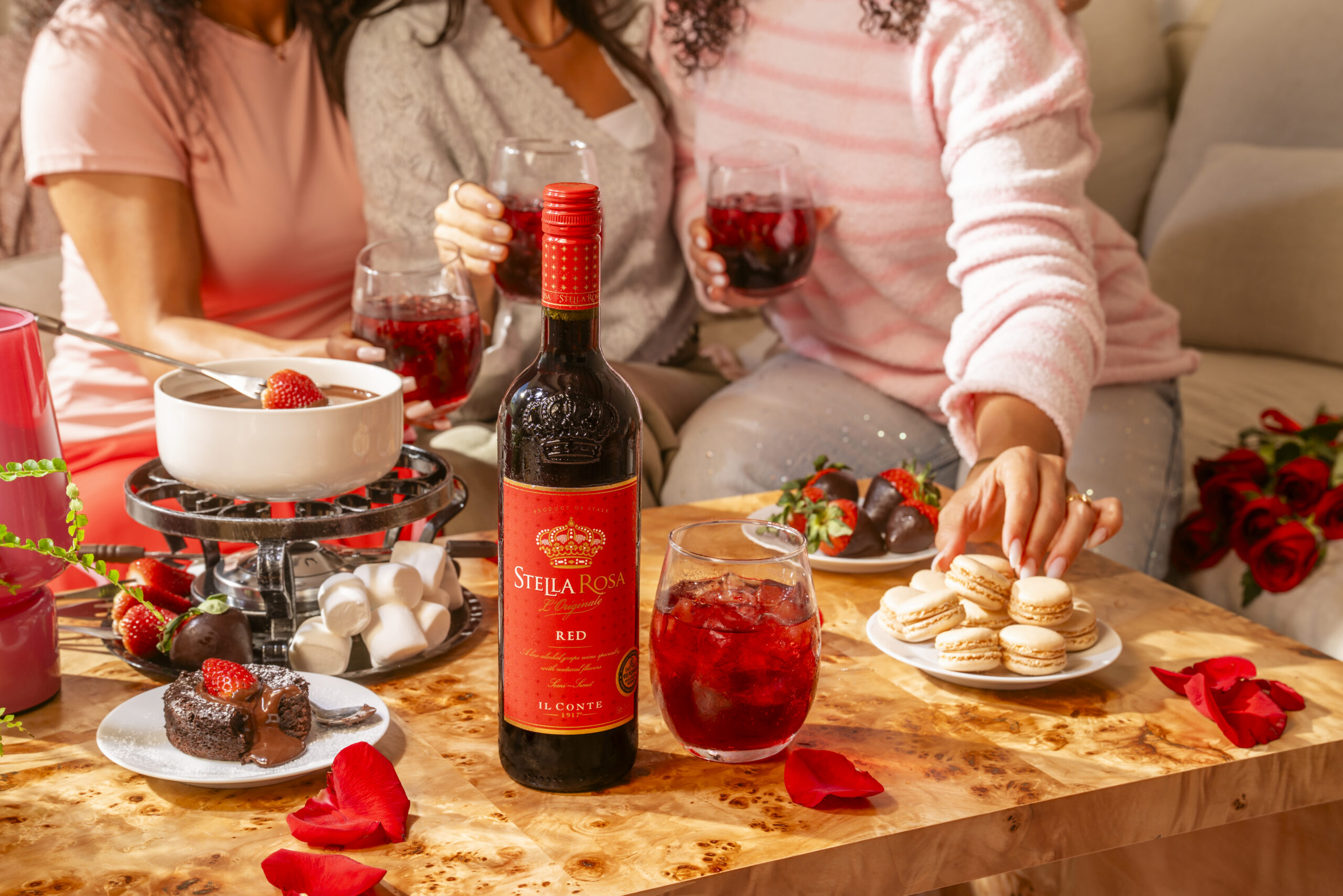 Friends enjoy a bottle of Stella Rosa Italian red wine