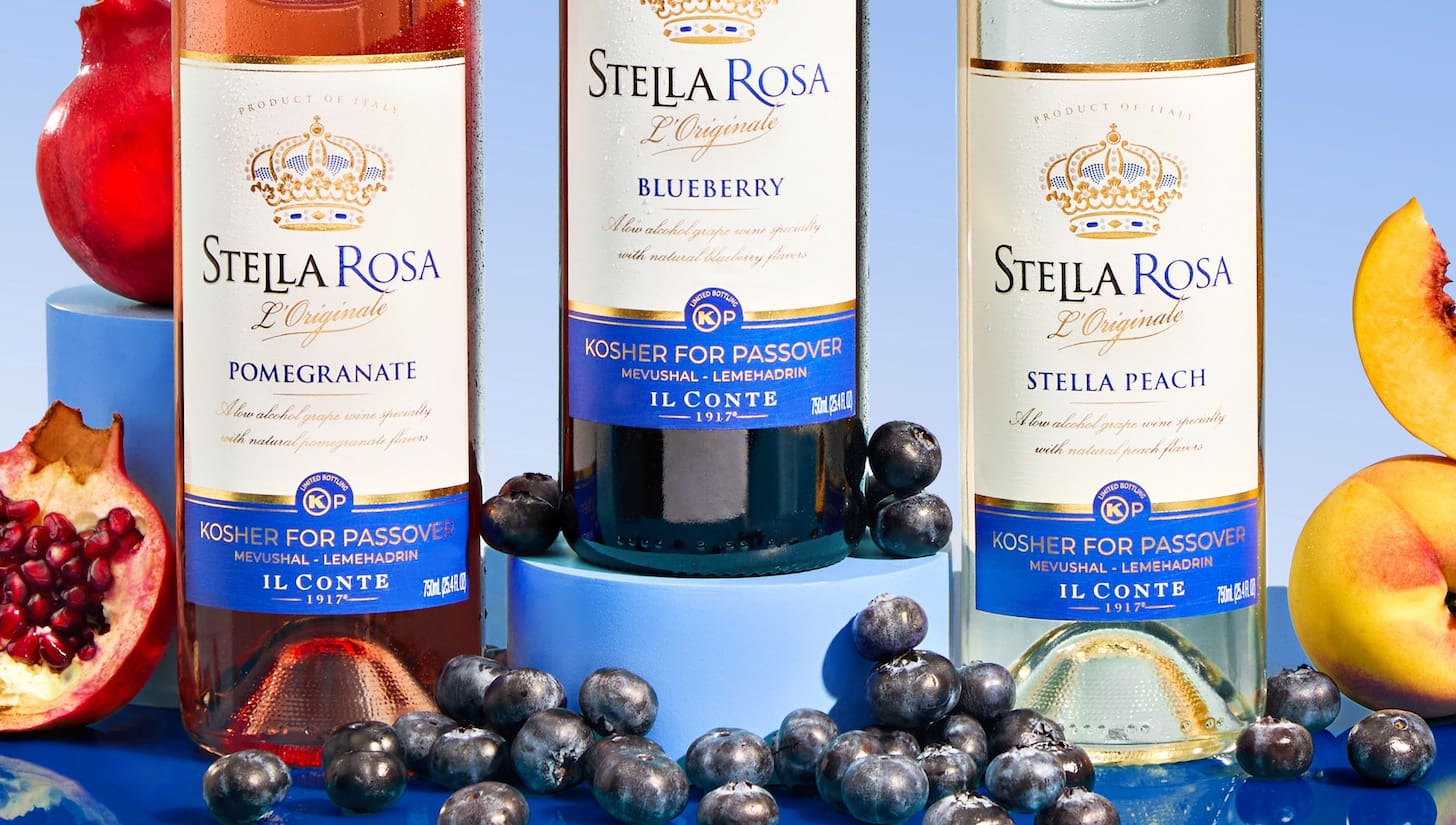 Stella Rosa Pomegranate, Blueberry, and Peach kosher wines with Kosher for Passover certification, displayed with fresh fruit.